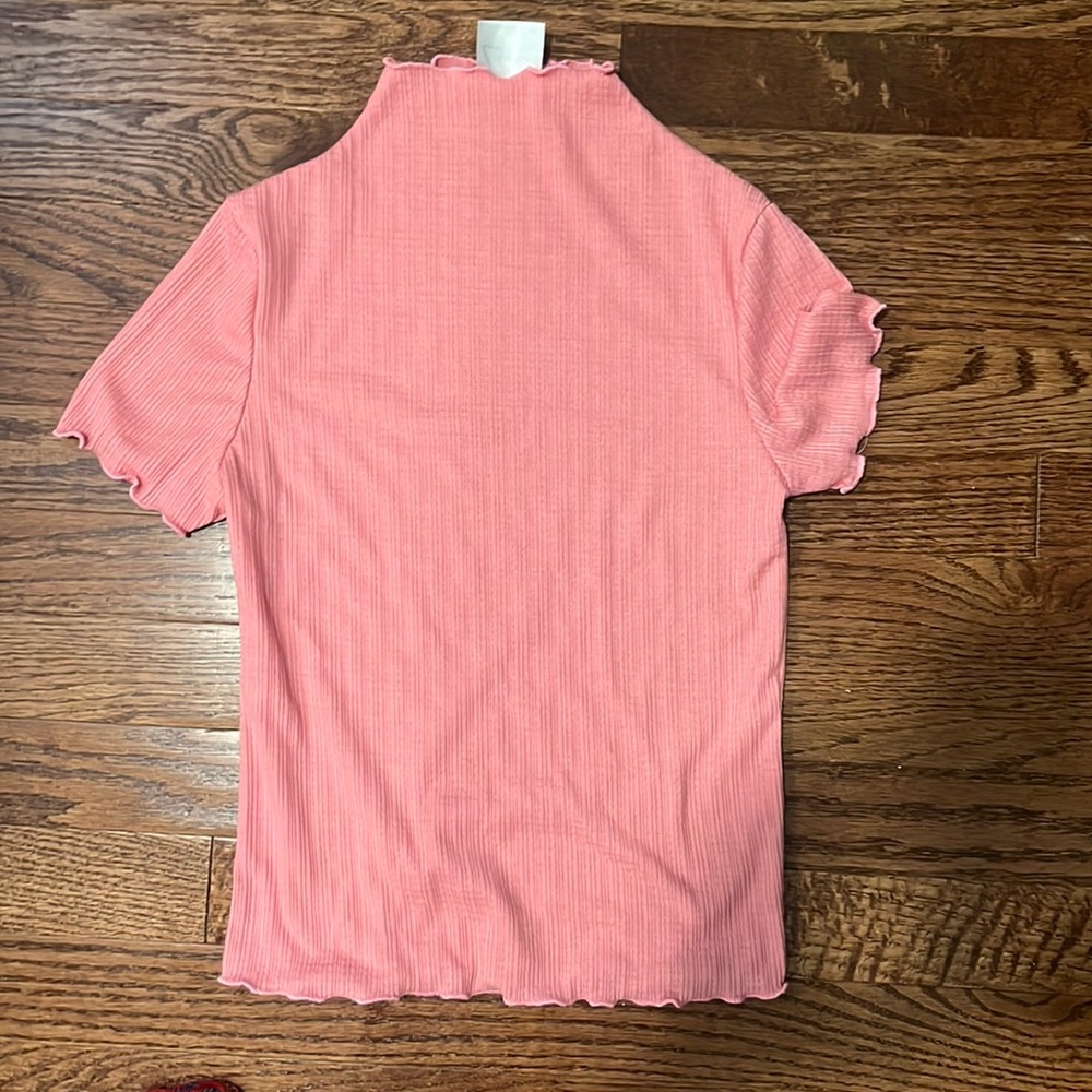 It is a pink XS blouse, and the brand is Livi by Olivia Rae